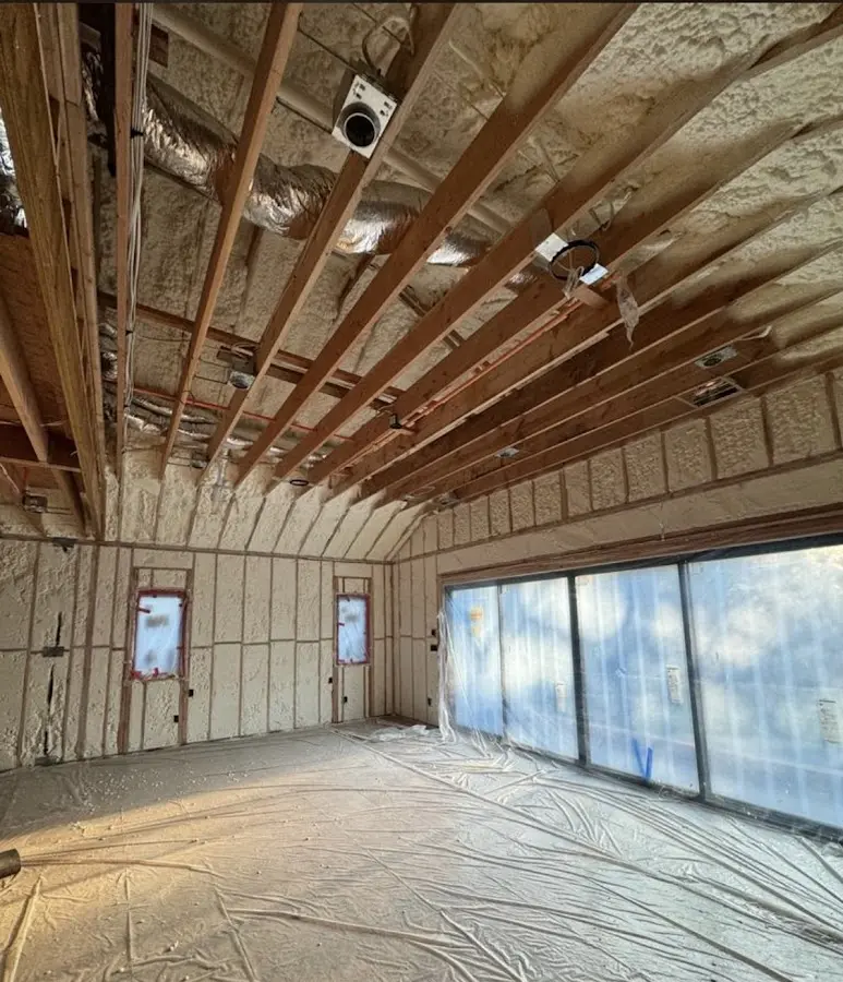 Interior walls and ceiling insulated with spray foam during new construction in Nashville